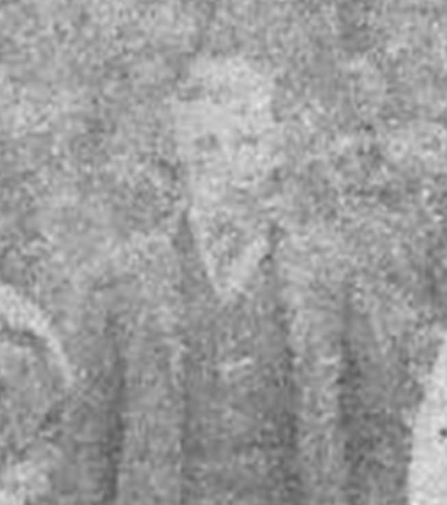 An old photo of a person
Description automatically generated